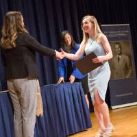 Emily shaking hands with Jessie Webb